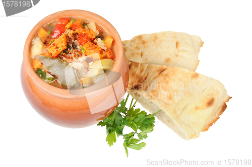 Image of Roast in a pot and pita bread
