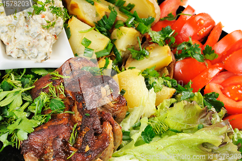 Image of Grilled meat and potatoes