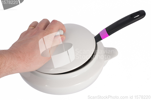 Image of Man hand removing tureen lid