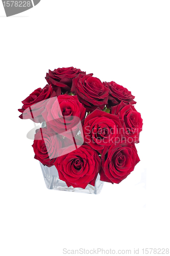 Image of Bunch of red rose flowers in a small vase (top view)