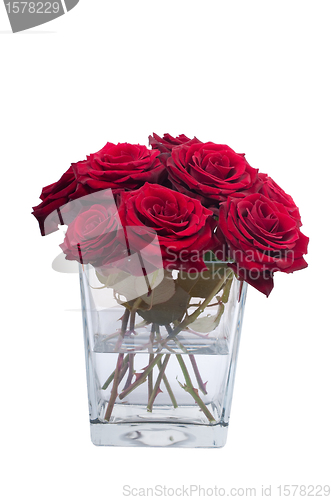 Image of Bunch of red rose flowers in a small vase