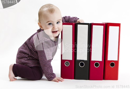 Image of young child with ring file