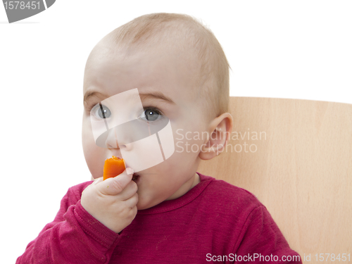 Image of child in red shirt eating