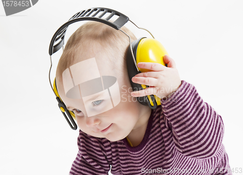 Image of young child with ear protector