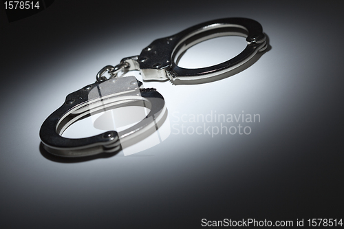 Image of Abstract Pair of Handcuffs Under Spot Light - Text Room