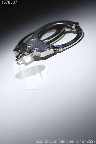 Image of Abstract Pair of Handcuffs Under Spot Light - Text Room