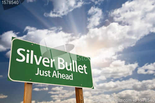 Image of Silver Bullet Just Ahead Green Road Sign and Clouds