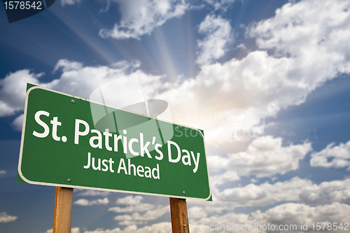 Image of St. Patricks Day Just Ahead Green Road Sign and Clouds