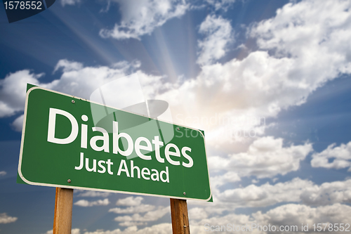 Image of Diabetes Just Ahead Green Road Sign and Clouds