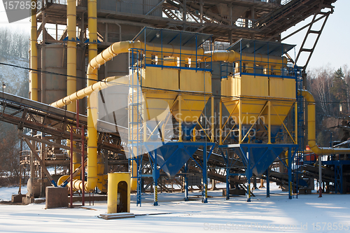 Image of Stone quarry with silos, conveyor belts in winter
