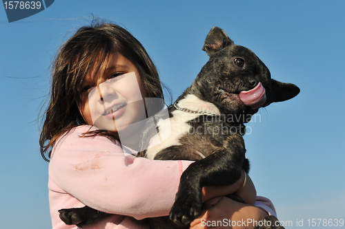 Image of french bulldog and child