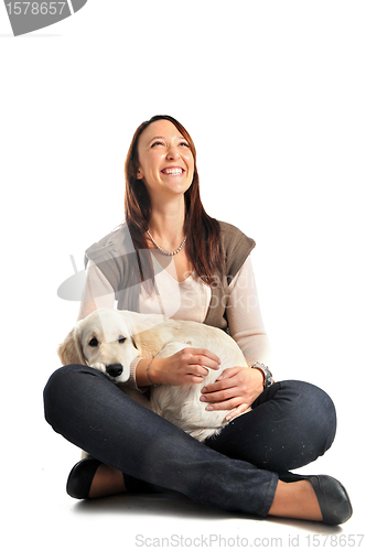 Image of puppy golden retriever and girl