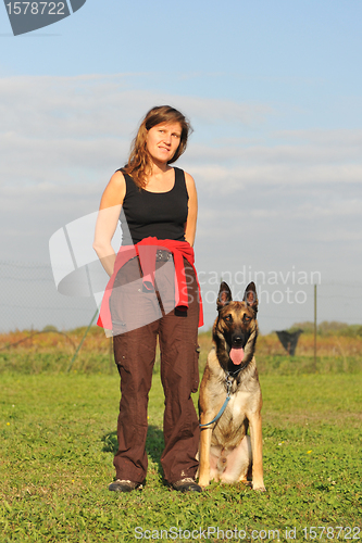 Image of malinois and woman