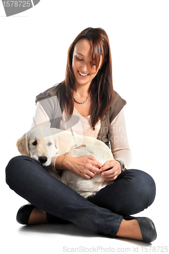 Image of puppy golden retriever and woman