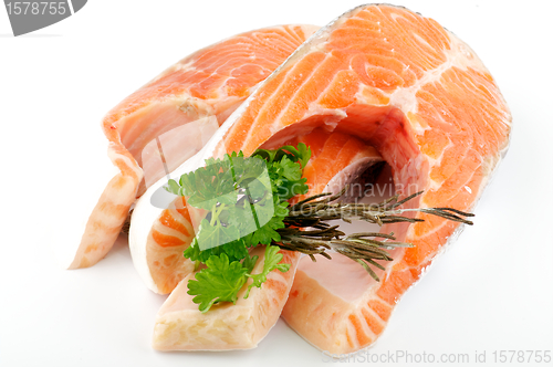 Image of Fresh steak of trout with parsley and rosemary