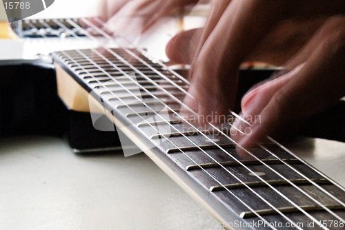 Image of fingers on guitar
