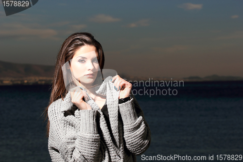 Image of beautiful woman by the sea