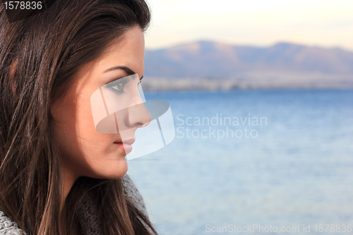 Image of beautiful woman by the sea