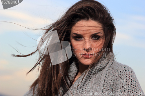 Image of beautiful woman by the sea