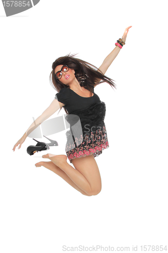 Image of Portrait of a pretty young woman jumping in joy 