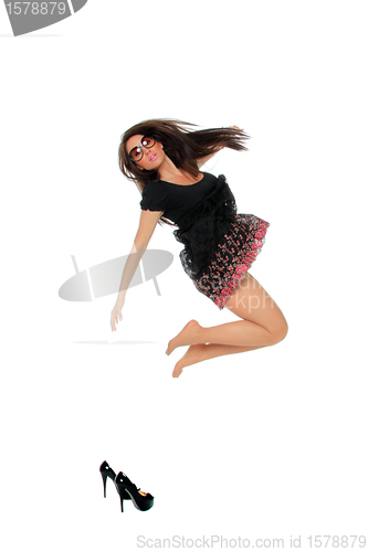 Image of Portrait of a pretty young woman jumping in joy 