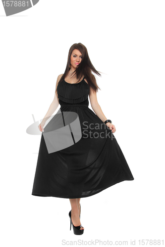 Image of Pretty sexy girl full length posing in a nice black dress