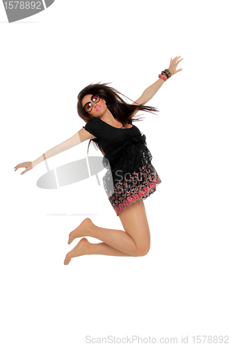 Image of Portrait of a pretty young woman jumping in joy 