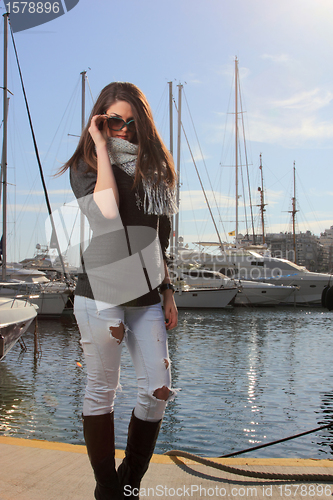 Image of Young woman at the port