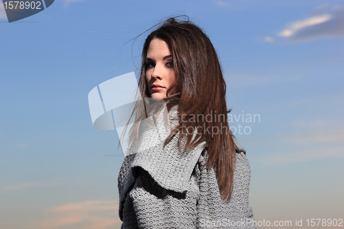 Image of beautiful woman by the sea