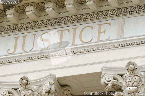 Image of justice word engraved