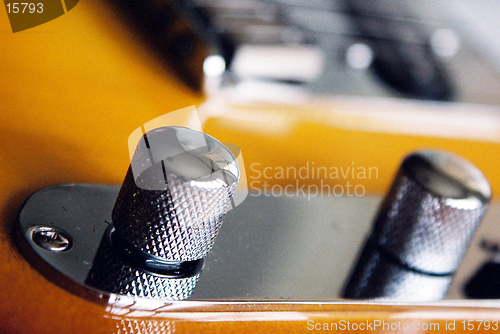 Image of close up of guitar knobs
