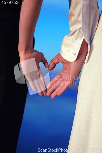Image of Couple With Hands Shaped like Hearts