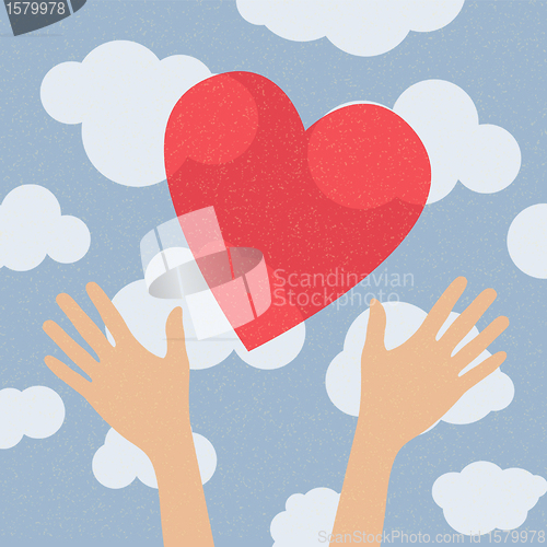 Image of hands holding the heart. charity