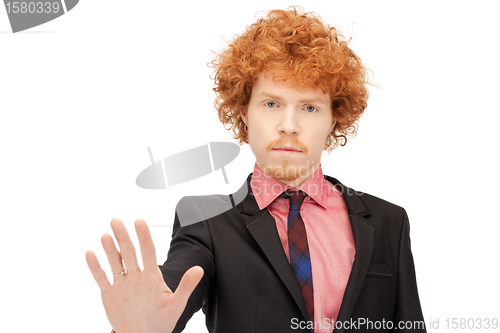 Image of man making stop gesture