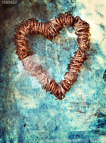 Image of grunge heart on blue wall