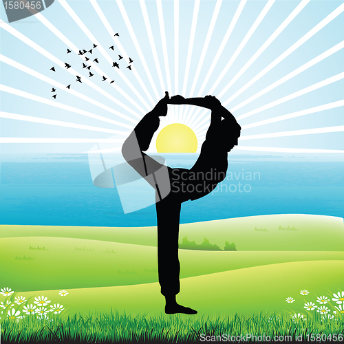 Image of silhouette of human doing yoga, sunrise background