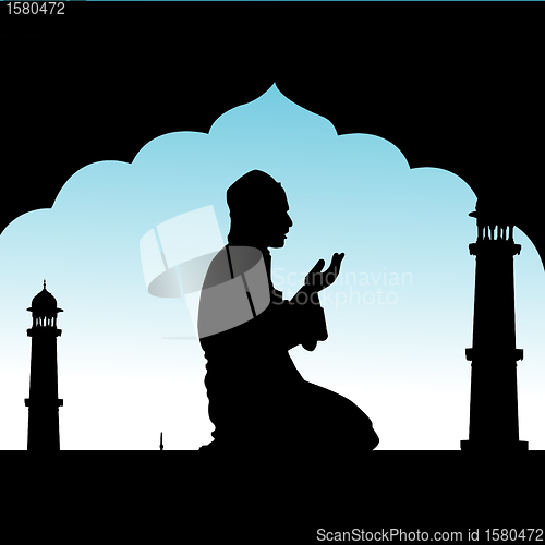 Image of silhouette of human offering prayers at mosque