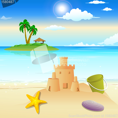 Image of landscape view of beach, sandcastle, starfish, shells