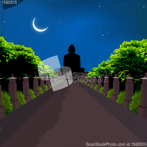 Image of silhouette view of buddha statue, crescent shaped moon