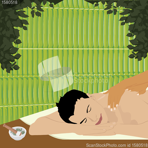 Image of man having an ayurvedic massage in a bamboo shed