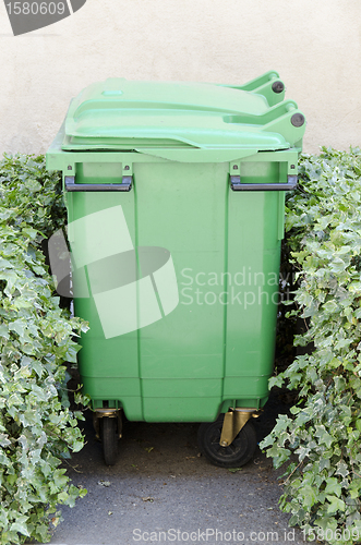 Image of green garbage container