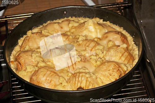 Image of apple cake in the oven