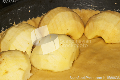 Image of preparing apples and dough for an apple cake