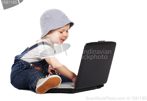 Image of Little boy with a laptop