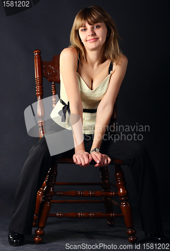 Image of Girl sitting on a chair