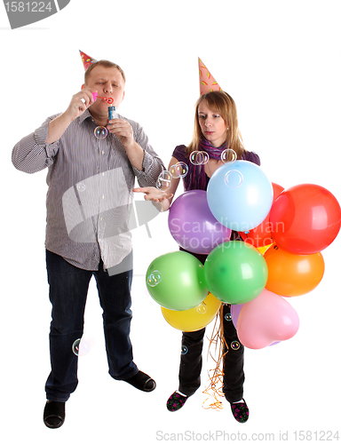 Image of Happy Couple with baloons and bubbles