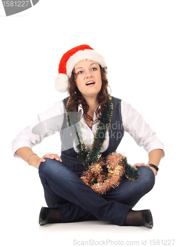 Image of Girl in a santa hat with christmas decoration