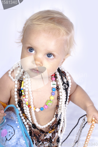 Image of beautiful little girl with beads and neacklace
