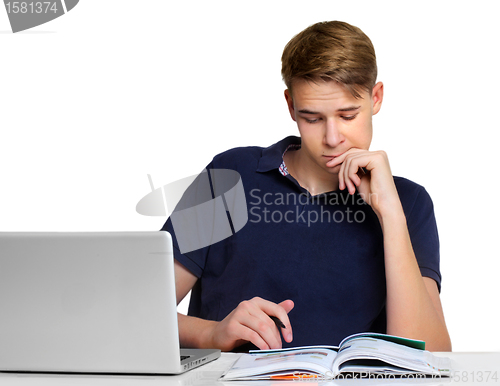 Image of Teenage boy working on the laptop