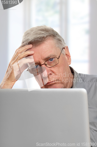 Image of 	senior using laptop